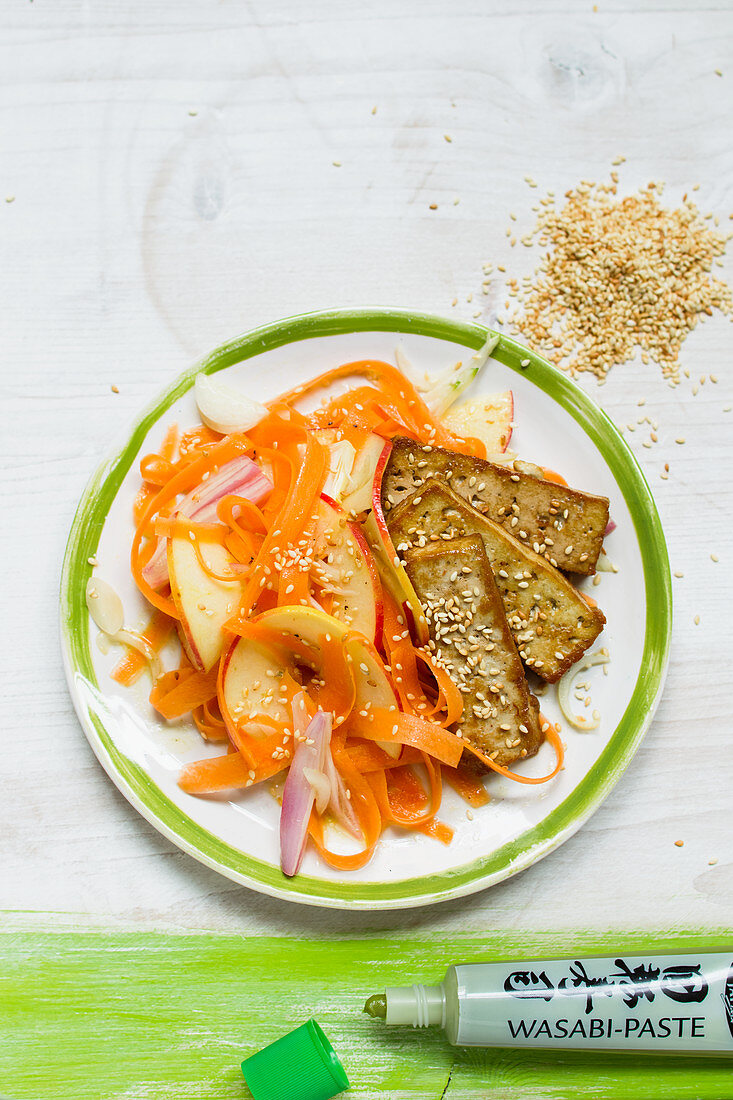 Vegan carrot and apple salad with sesame tofu