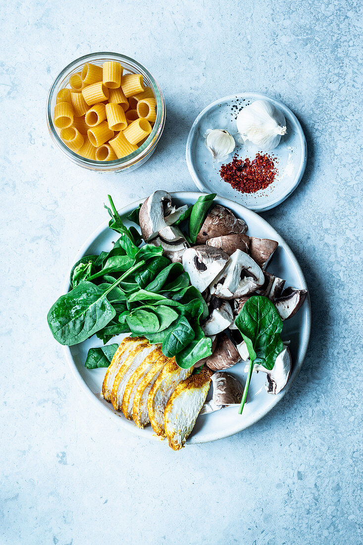 Ingredients for pasta with spinach, mushrooms and chilli