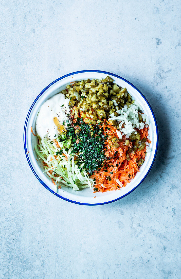 Coleslaw with white cabbage, carrots, pickles and chives