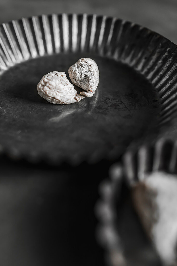 Dried figs on dark vintage baking mold