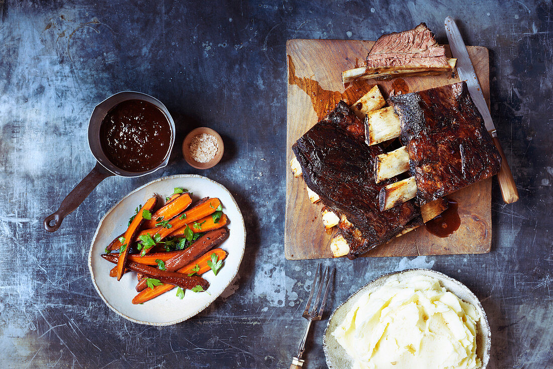 Twice-baked beef short ribs with dripping carrots and gravy and smoked mash