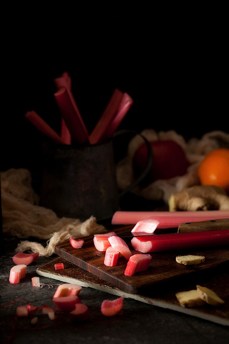 Forced rhubarb being chopped on a wooden board