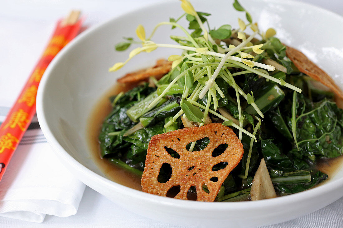 Preserved mustard greens, ginger, house-made superior stock with lotus root chip garnish