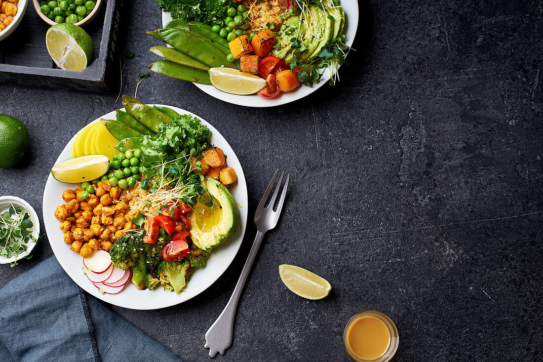 Healthy vegetarian lunch bowl with avocado, chickpeas, quinoa, microgreens and vegetables
