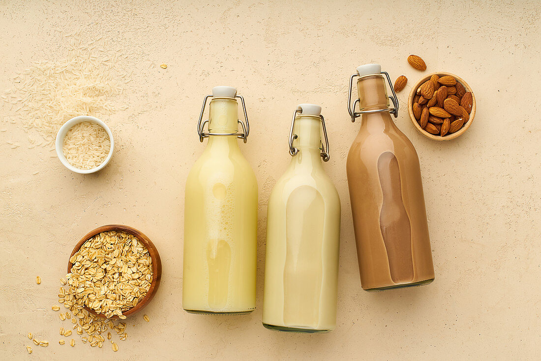 Oat milk, rice milk and chocolate almond milk in flip-top bottles