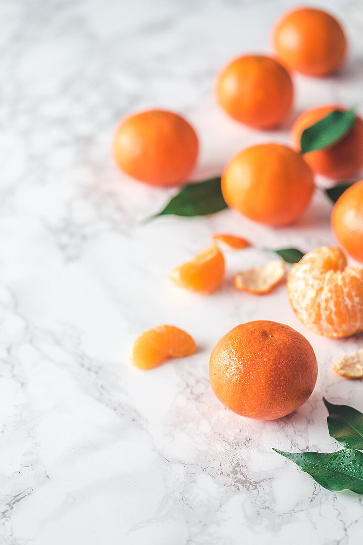 Fresh clementines on a marble surface