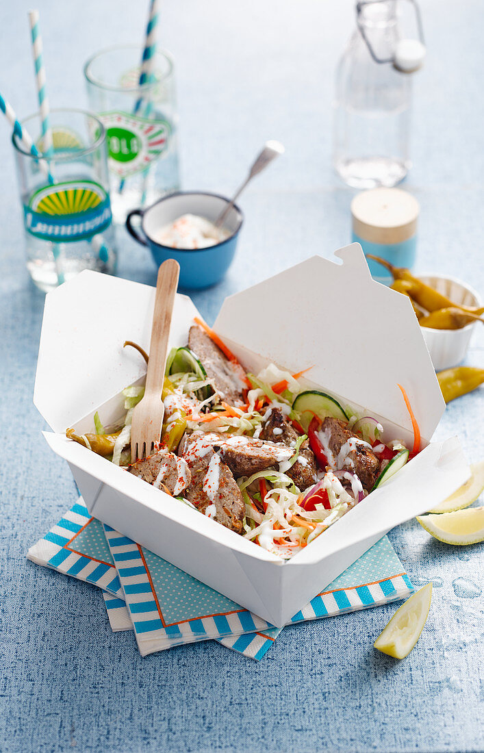 Lamb doner kebab with vegetables in a box