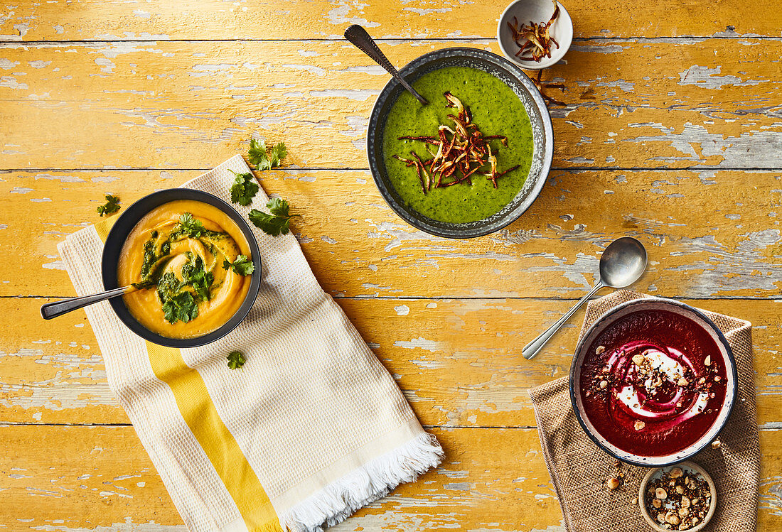 Three colorful soups - Beetroot, cumin and coriander soup with yogurt and hazelnut dukkah, sweet potato, coconut and lemongrass soup with coriander sambal