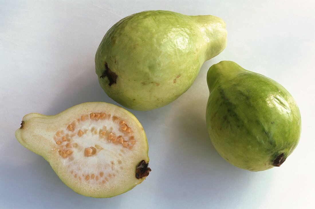 Two whole guavas and half a guava