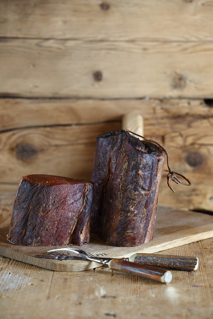 Bacon from pastured-reared pork on a wooden board