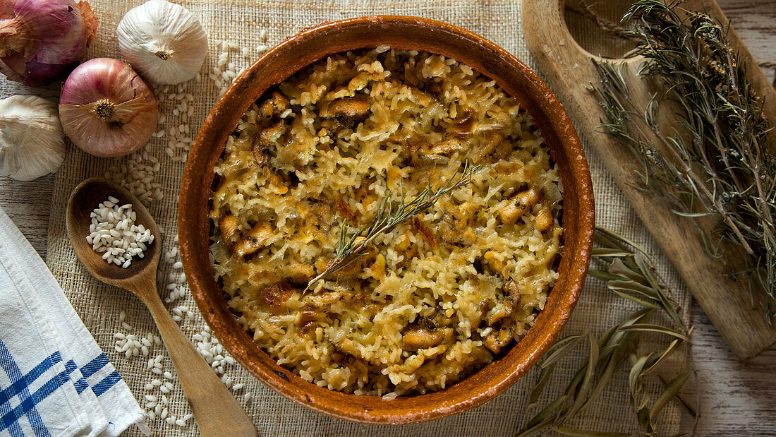 Traditional Spanish Arroz al horno. Rice with chicken cooked in a oven