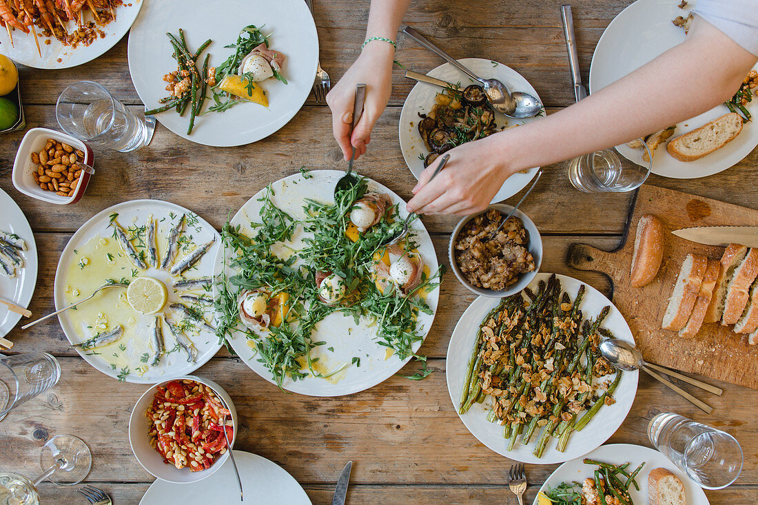 A table laid for a barbecue party with various side dishes