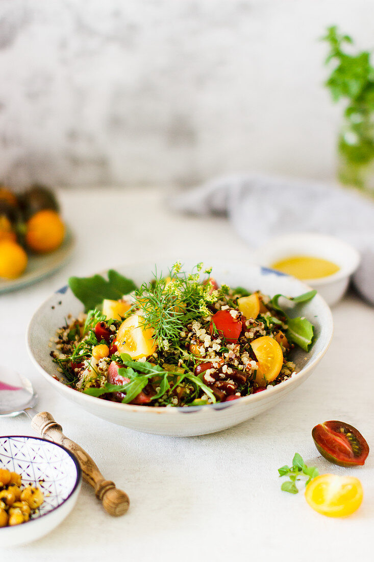 Quinoa salad with yellow tomatoes and fresh herbs
