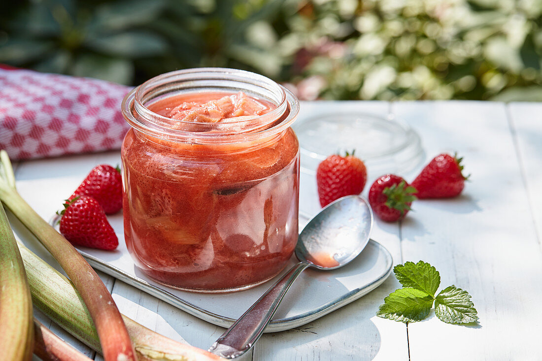 A jar of rhubarb and strawberry compote