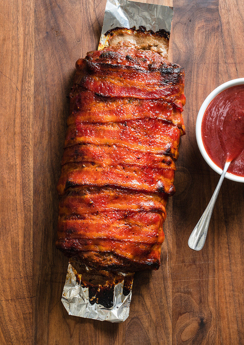 Bacon wrapped meat loaf with smoky barbecue sauce