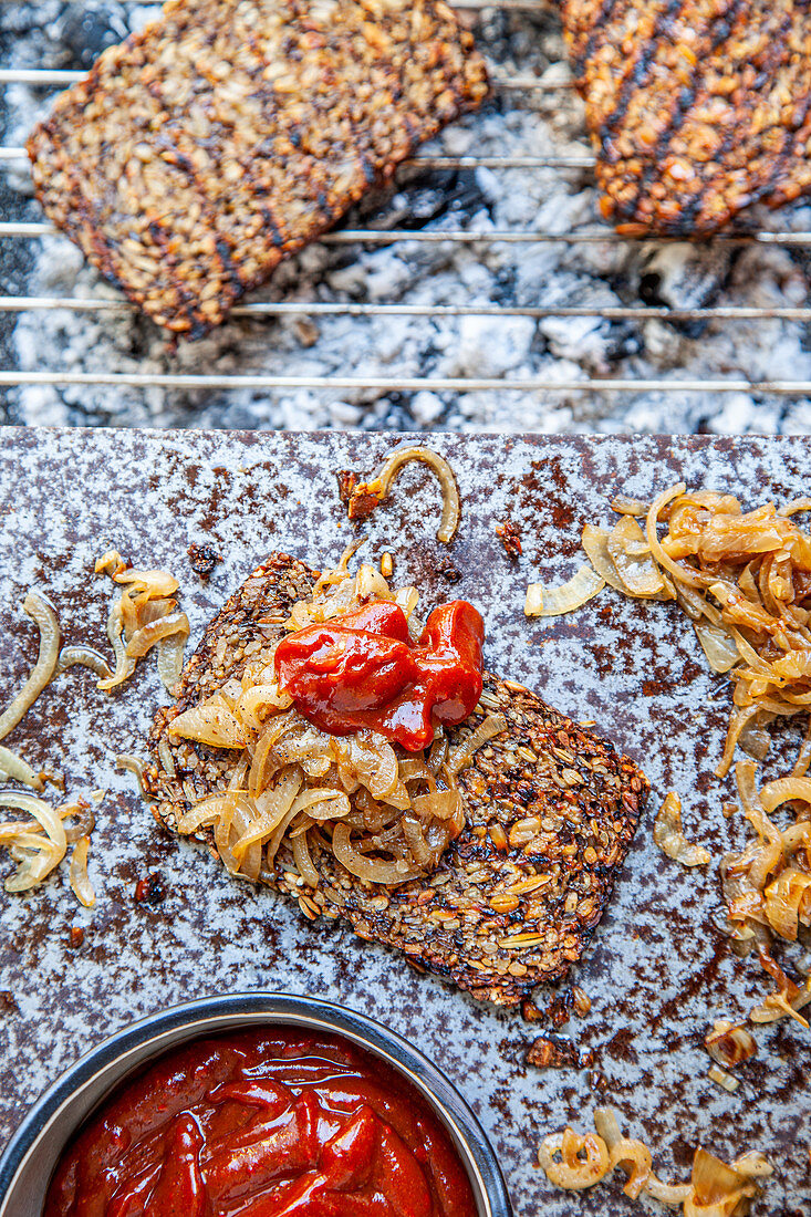 Grilled seed crackers with onions and BBQ sauce