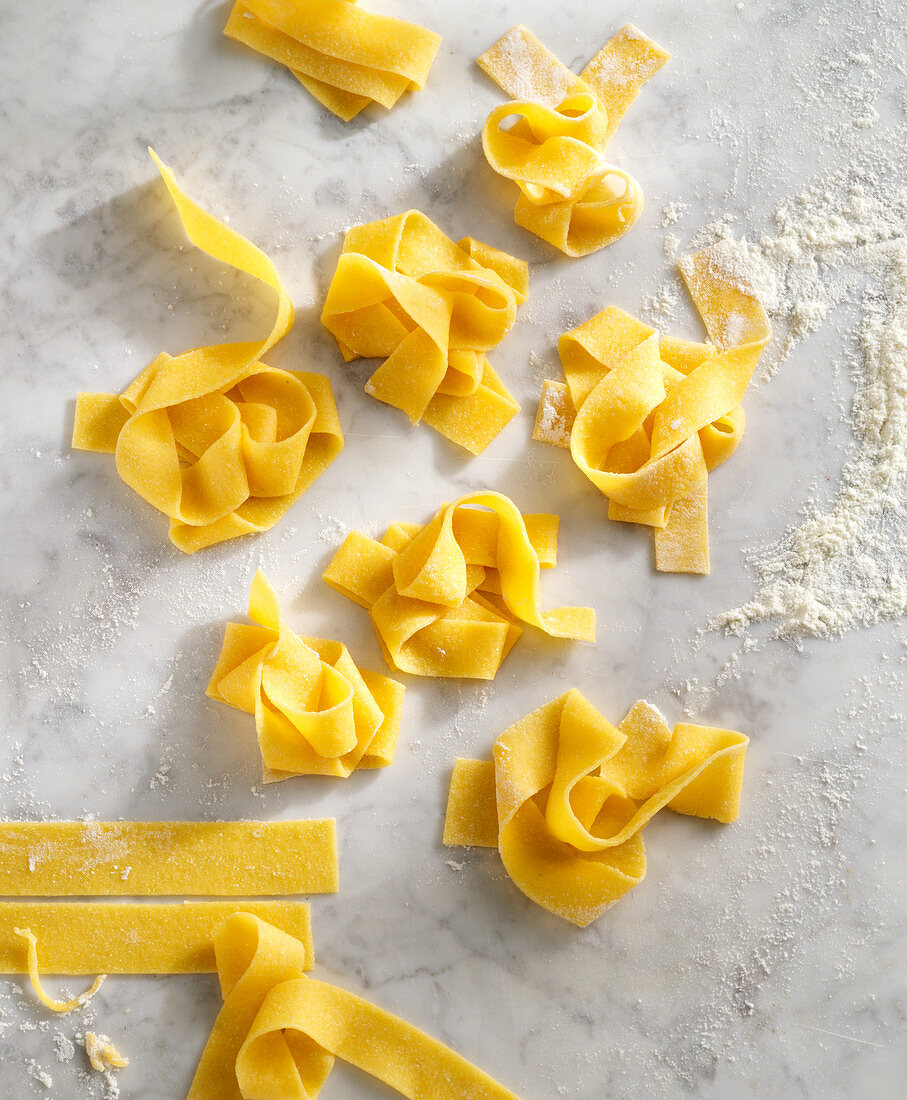 Pasta nests on a marble surface