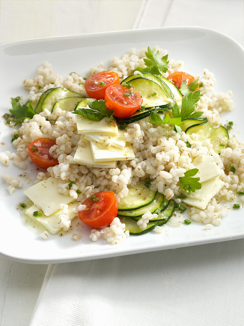 Mediterranean barley salad with feta cheese, cucumber and tomatoes