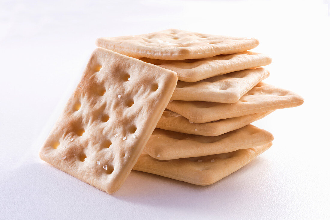 Gluten-free crackers on white background