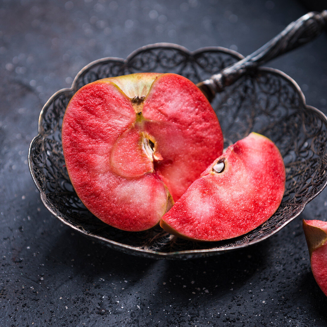 A sliced Red Moon apple