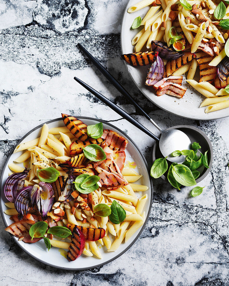 Penne with grilled plums, bacon and basil