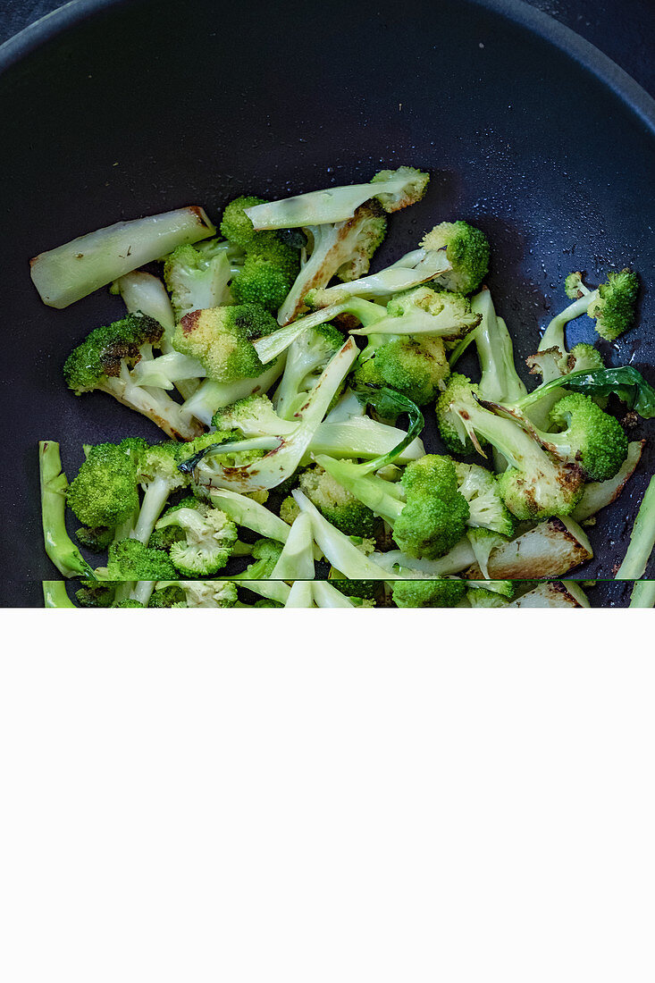 Fried broccoli in a wok
