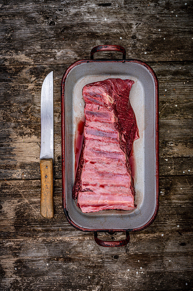 Beef ribs in a roasting tin