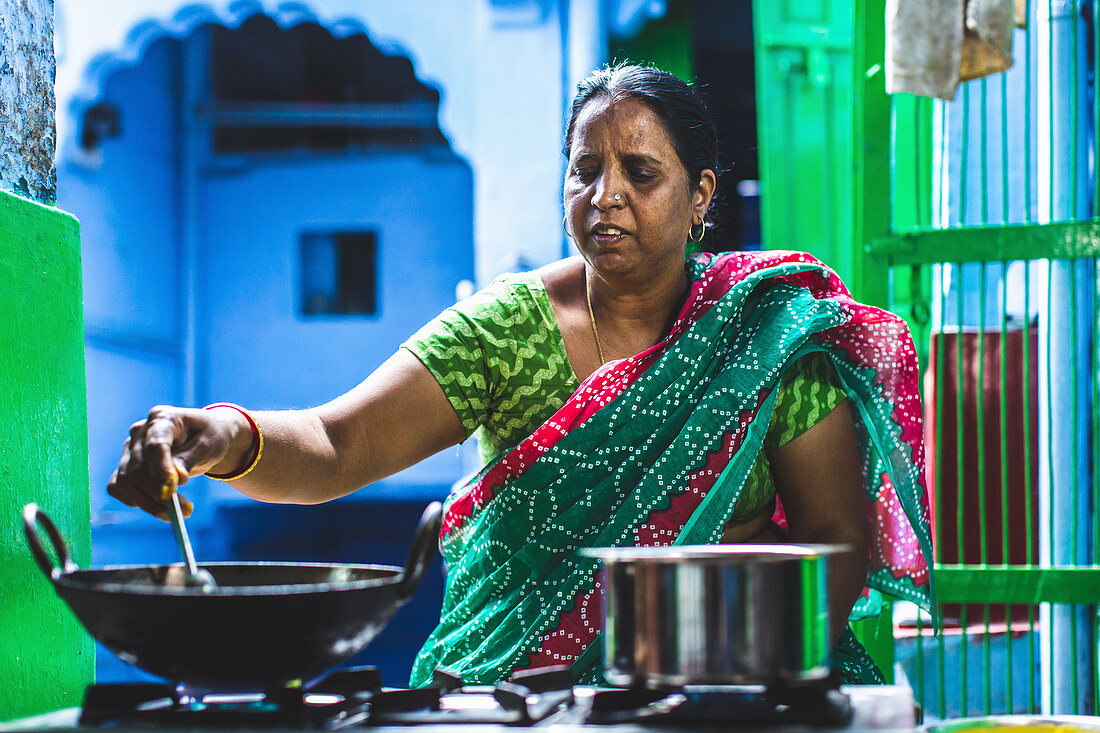 A woman preparing street food, India