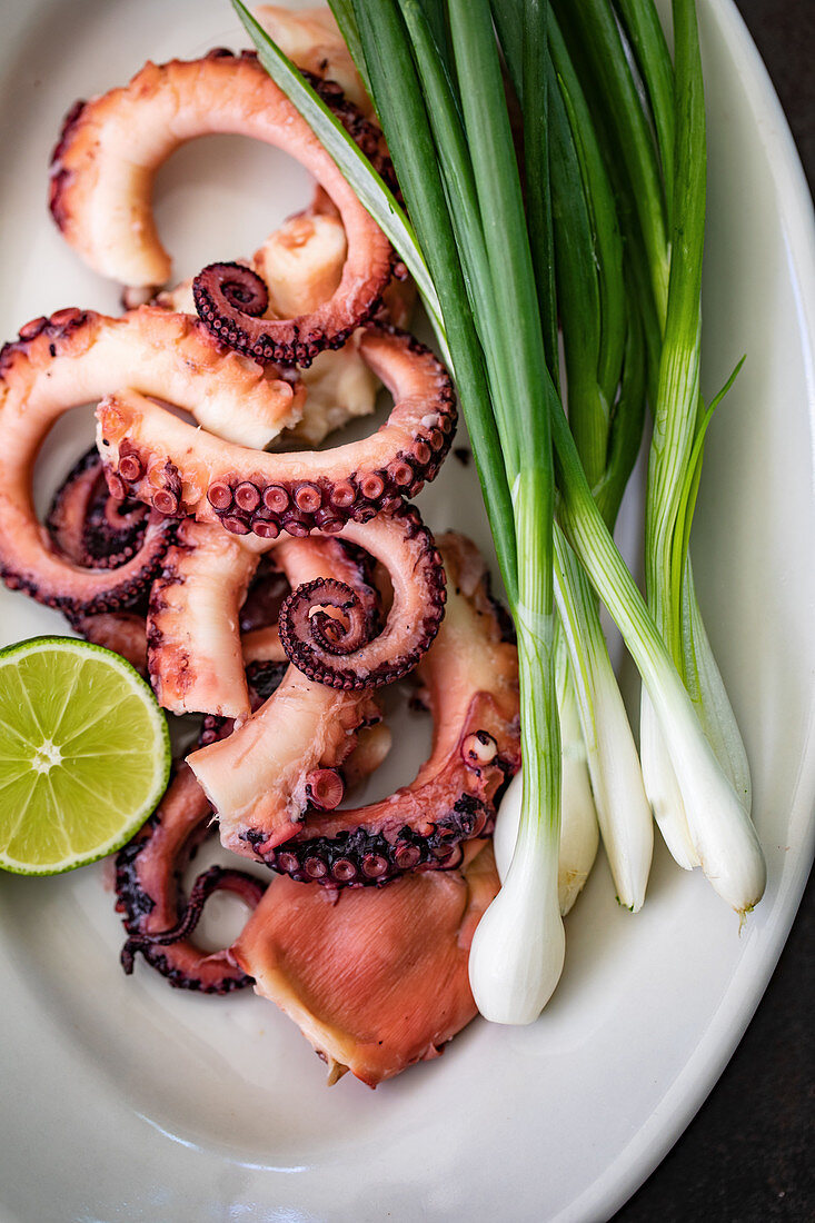 Grilled octopus with spring onions and limes