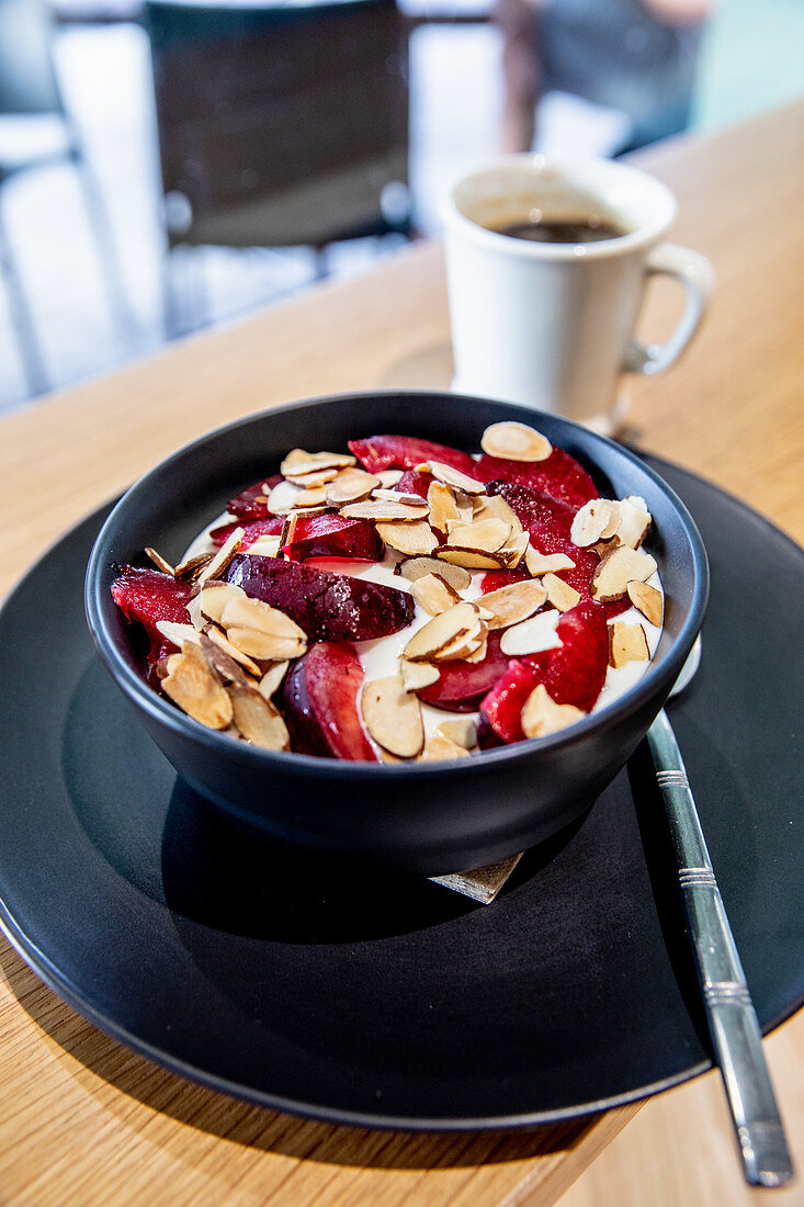 Yoghurt muesli with nuts and plums