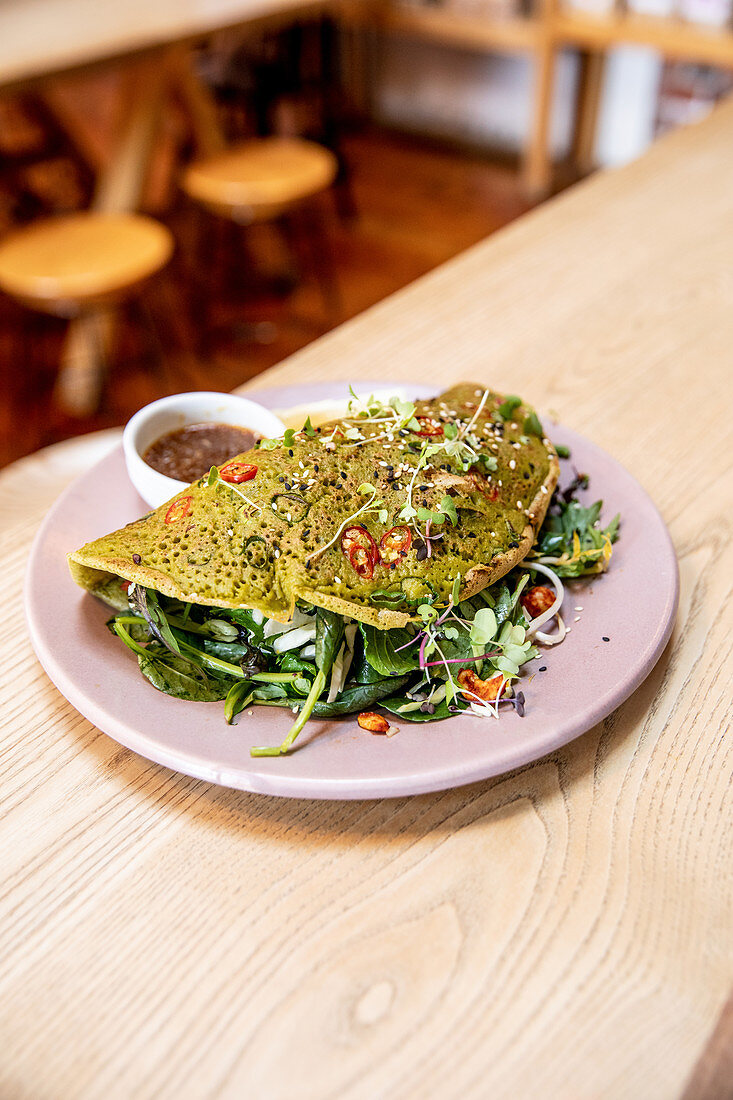 Green omelette with spinach, herbs and chilies