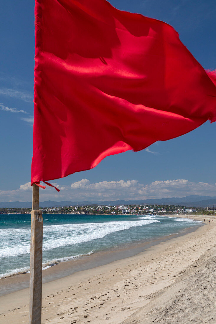 Red flag on Pacific Ocean beach, Mexico