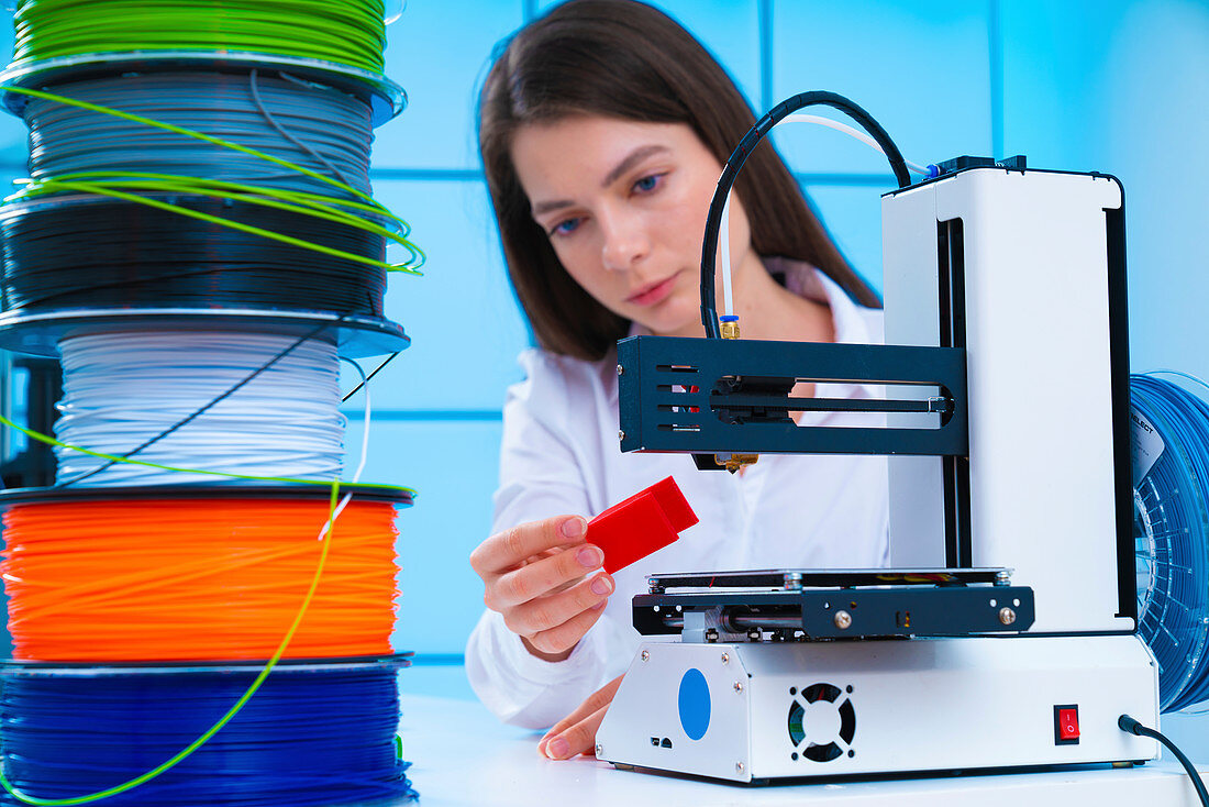 Woman using 3d printer