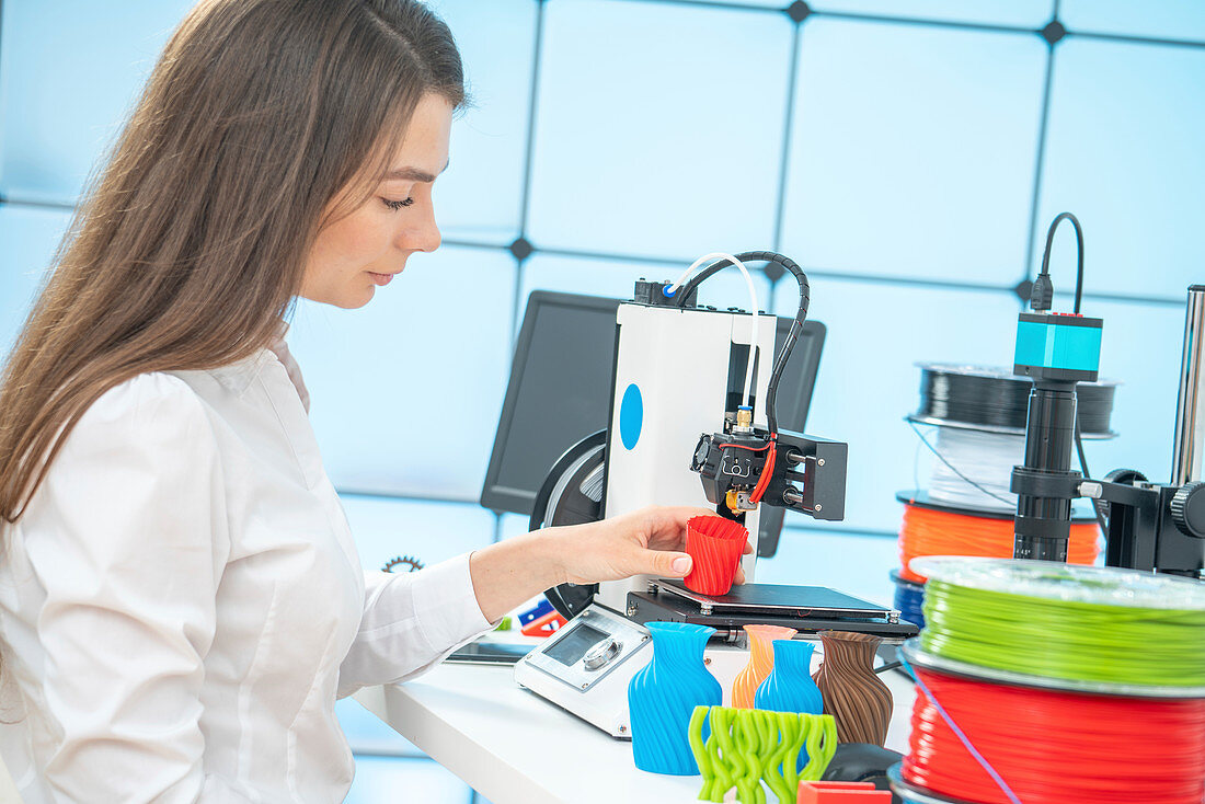 Woman using 3d printer