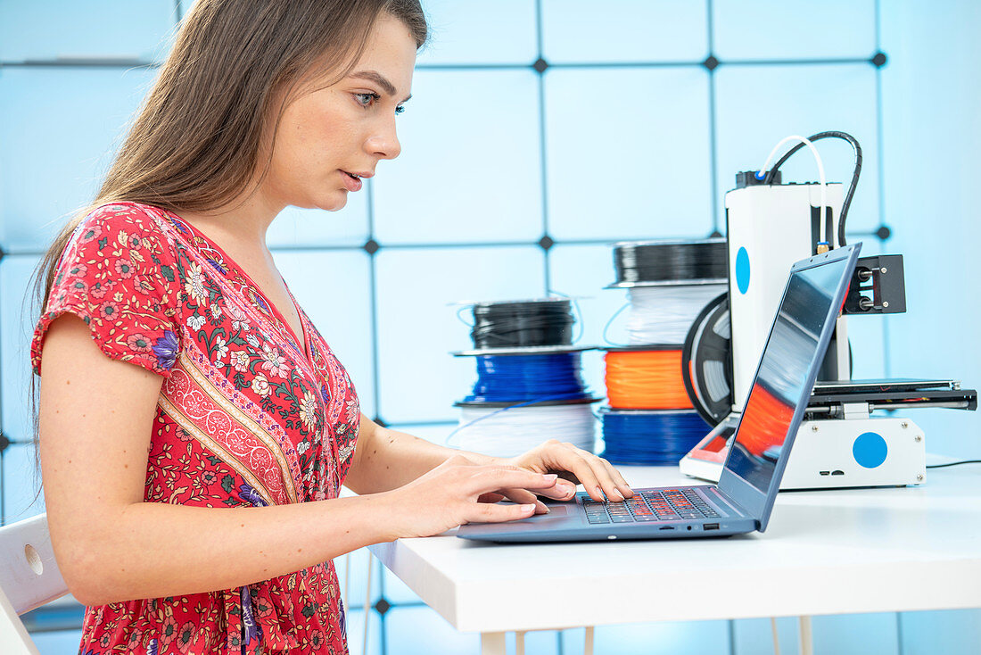 Woman using 3d printer