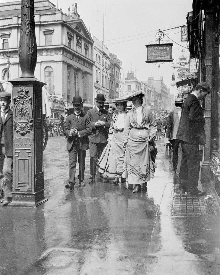 Two suffragettes walking along a pavement, London, 1900s