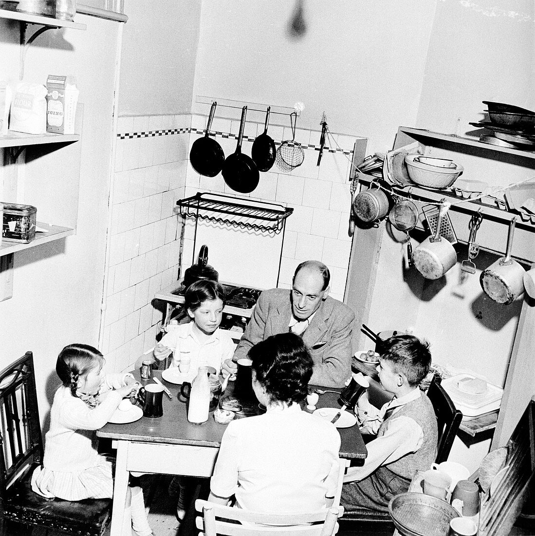 A family dining in their London home, c1950s