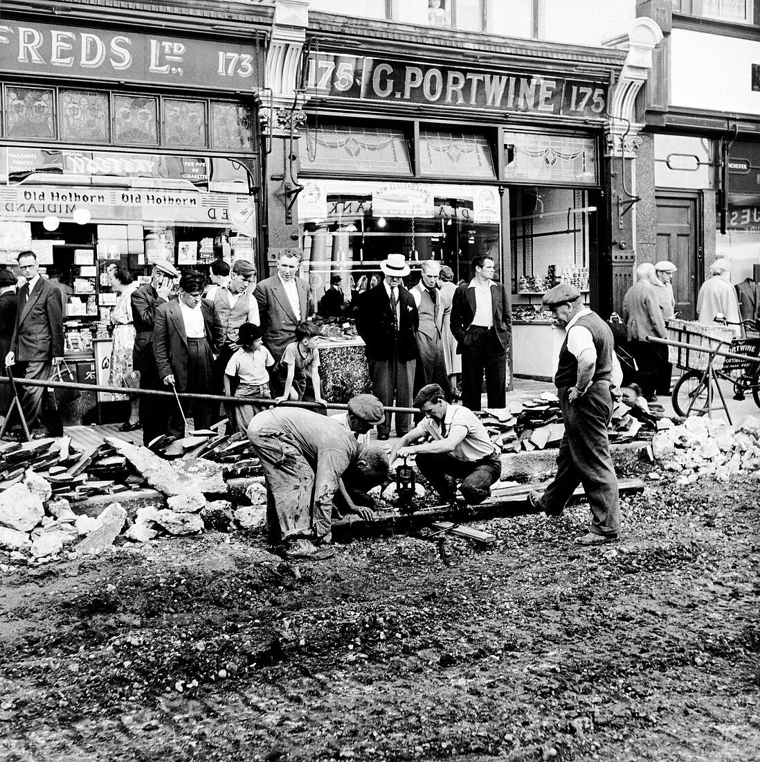 Road repairs in Portobello Road, London, c1956