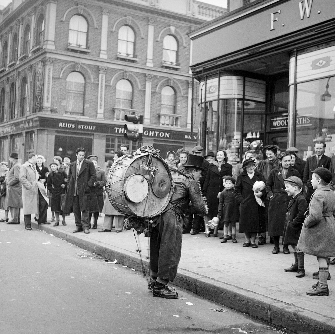 One-man band performing, Camden, London, 1952