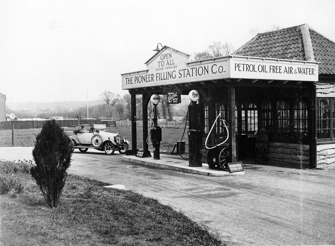 1923 10 hp Calcott arriving at a petrol station
