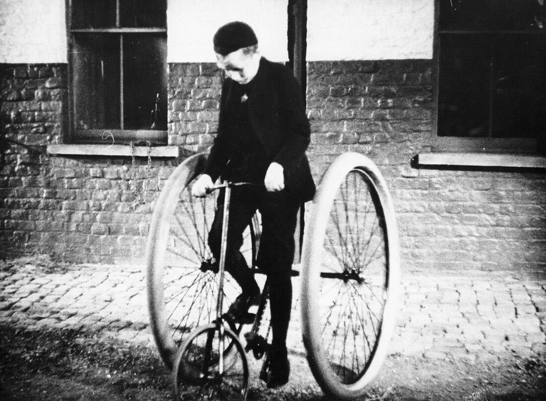 Johnny Dunlop riding his tricycle with rubber tyres, 1888