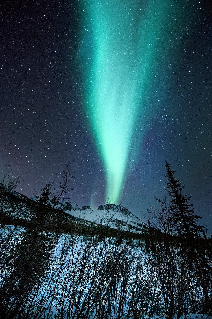 Aurora Borealis over a mountain in Alaska
