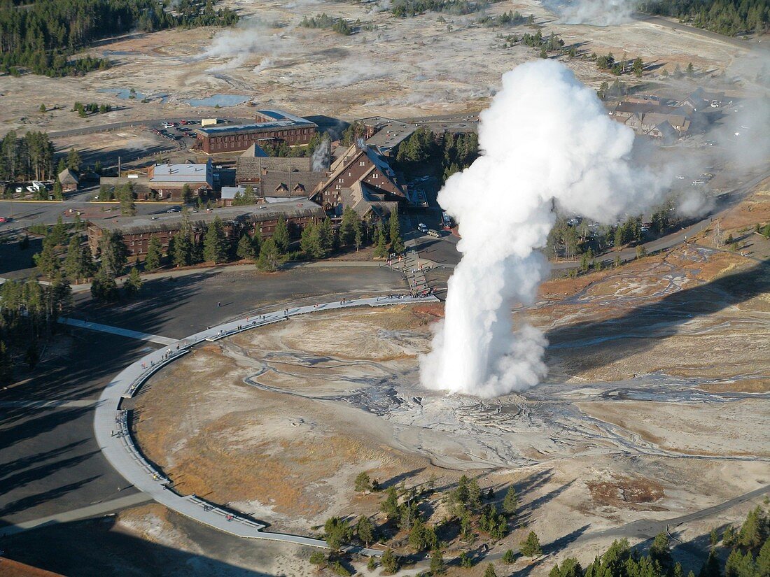 Old Faithful Geyser erupting, aerial image