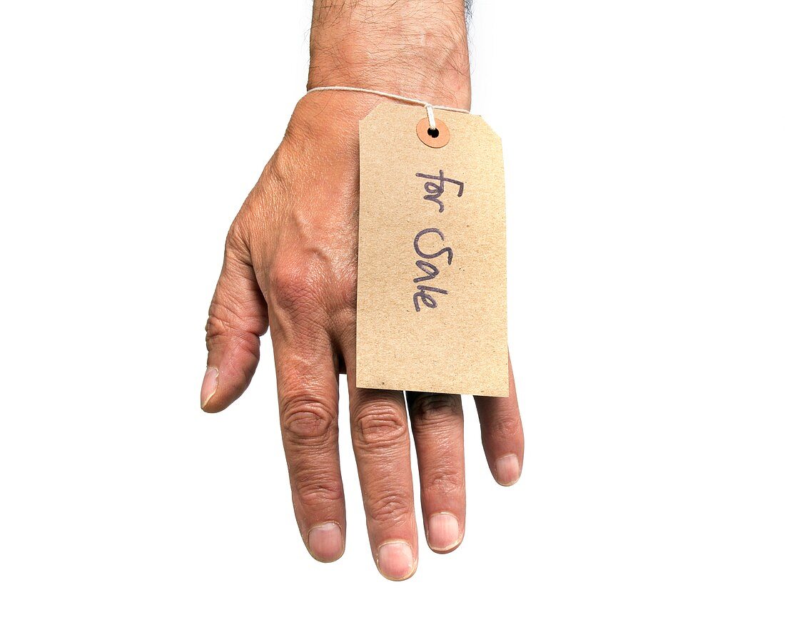 Hand with For Sale label