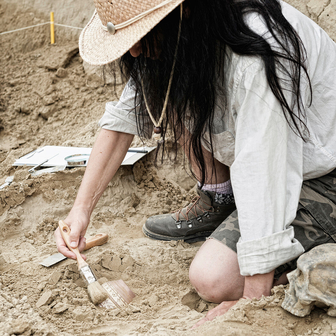 Archaeologist excavating pottery