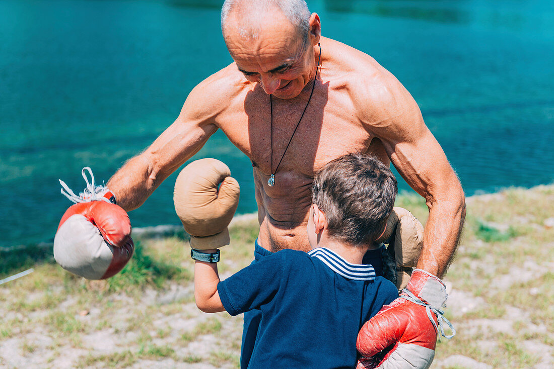 Grandfather and grandson boxing