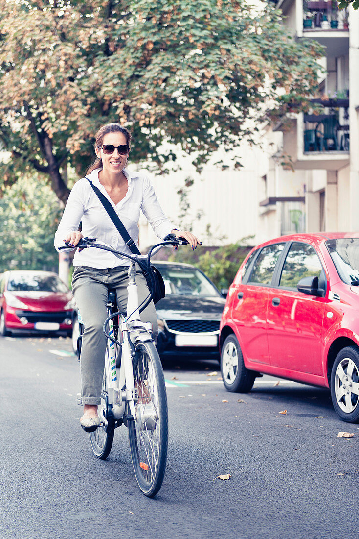 Woman riding electric bicycle
