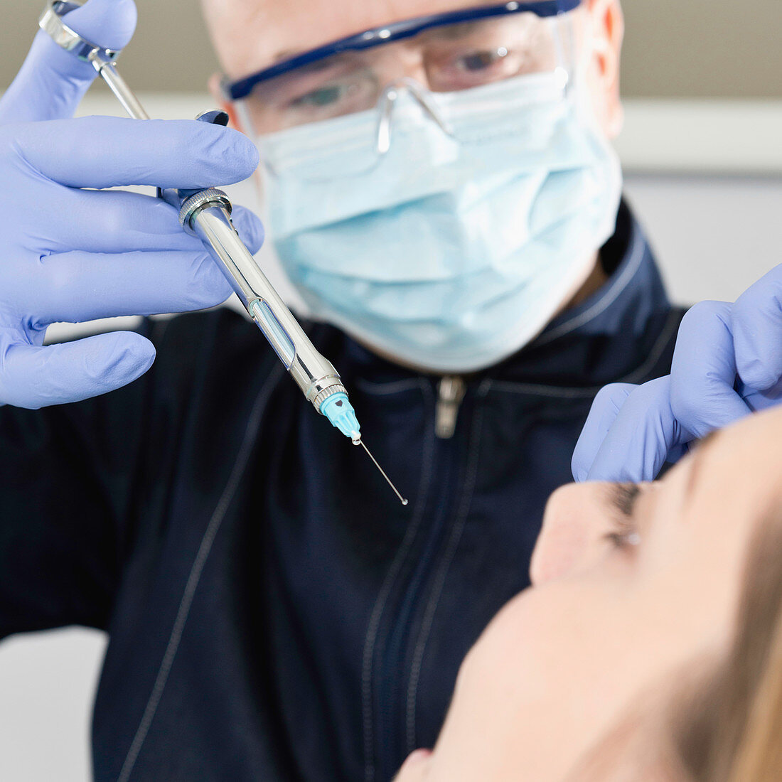 Patient receiving dental anaesthetic