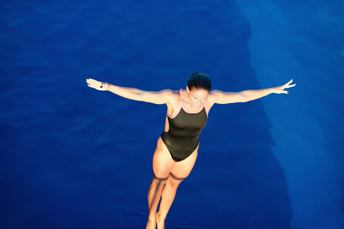 Female diver on platform