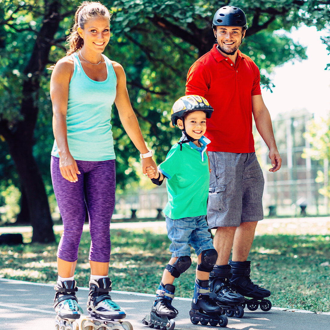 Portrait of family on roller skates in park